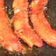 Image for article titled Give your Western breakfast a Korean twist with gochujang-fried bacon